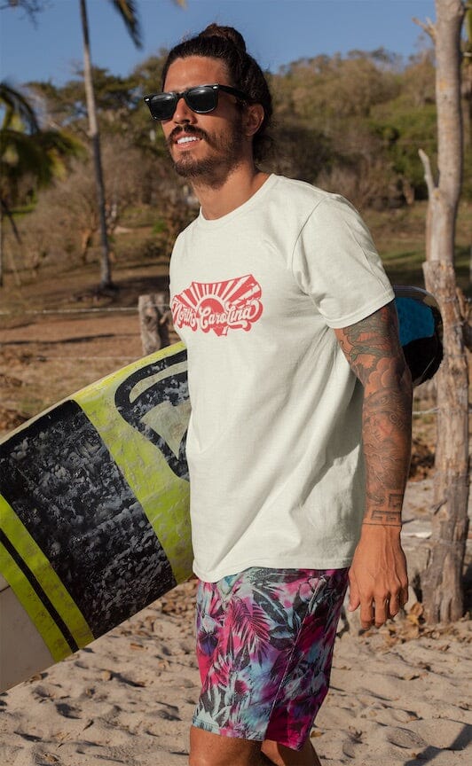 Surfer wearing NC Vintage Vibe Shirt